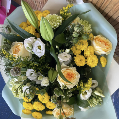 Hello Sunshine - A spectacular handtied bouquet in water presented in a gift box/bag. Created using yellow and white flowers with complimentary foliage. Hand delivered with care in and around Newcastle by Fantasia Florist.